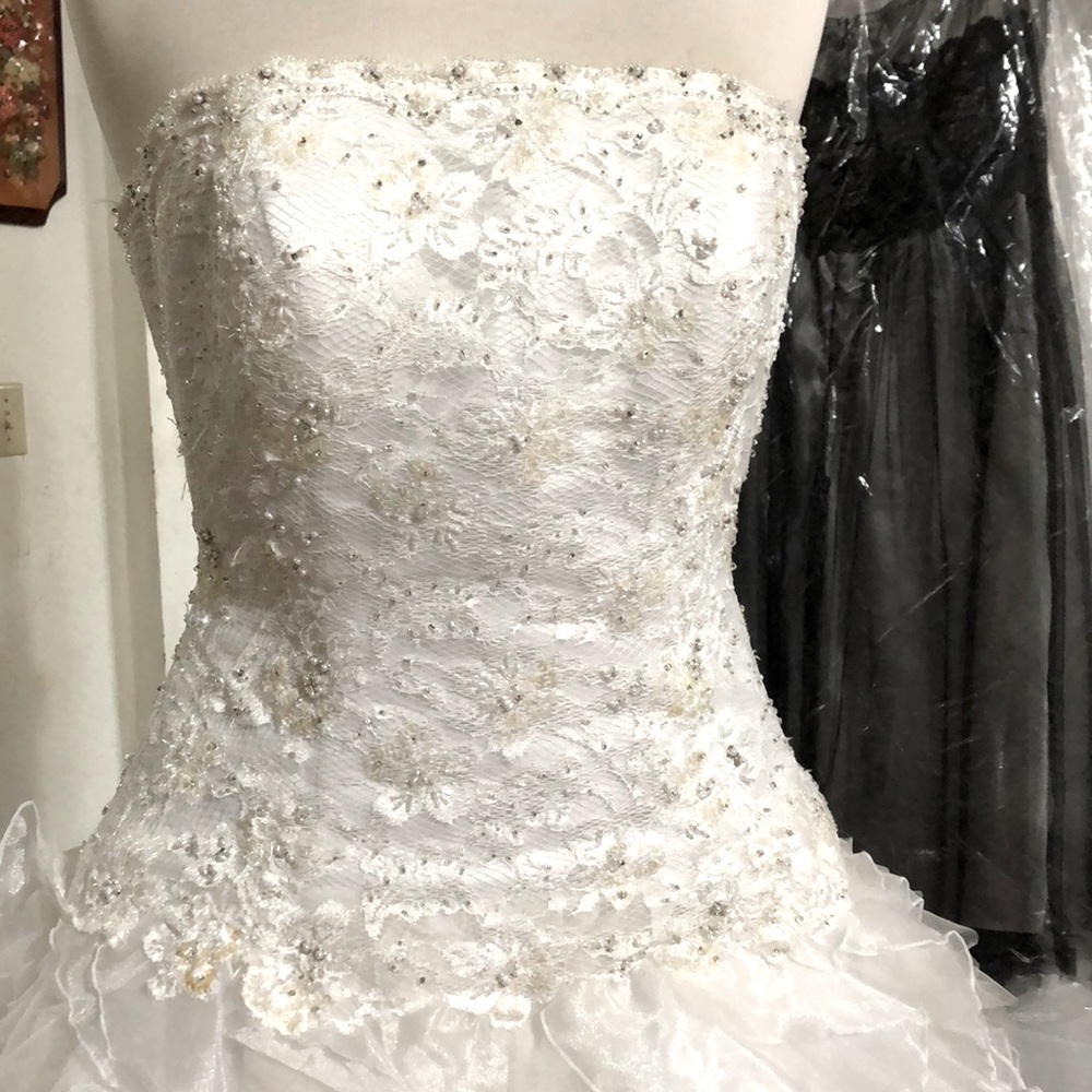 Monique Lou white wedding dress fr David Bridals.